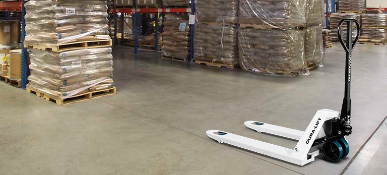 Operator pulling Mitsubishi hand pallet truck by handle